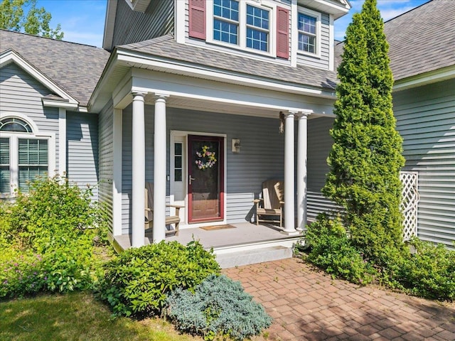 23 Surrey Ln, Laconia, NH 03246 - property entrance with covered porch and a shingled roof