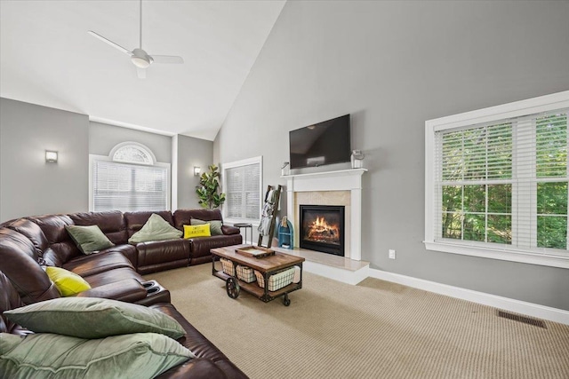 23 Surrey Ln, Laconia, NH 03246 - carpeted living area with high vaulted ceiling and a glass covered fireplace