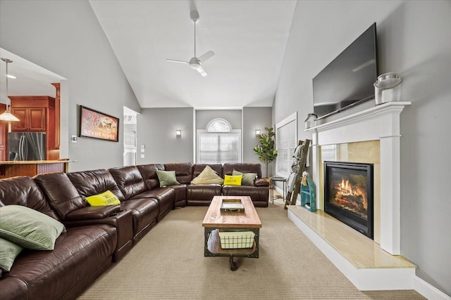 23 Surrey Ln, Laconia, NH 03246 - carpeted living area with ceiling fan, a fireplace, and high vaulted ceiling