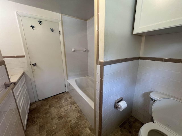 2 Kimball Ter, Danville, NH 03819 - bathroom featuring tile walls and a wainscoted wall