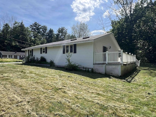 2 Kimball Ter, Danville, NH 03819 - view of property exterior with a wooden deck and a yard