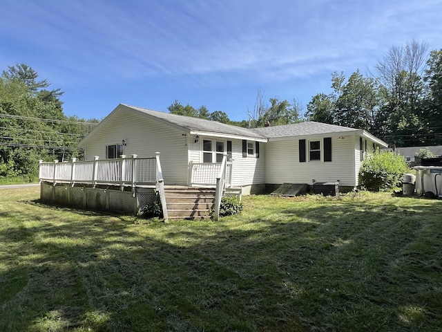 2 Kimball Ter, Danville, NH 03819 - back of property featuring a wooden deck, a lawn, and roof with shingles