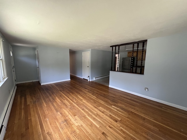 2 Kimball Ter, Danville, NH 03819 - unfurnished room with a baseboard radiator, a baseboard heating unit, and wood-type flooring