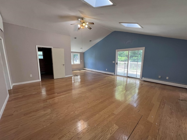 2 Kimball Ter, Danville, NH 03819 - unfurnished living room with baseboard heating, healthy amount of natural light, hardwood / wood-style flooring, a ceiling fan, and lofted ceiling