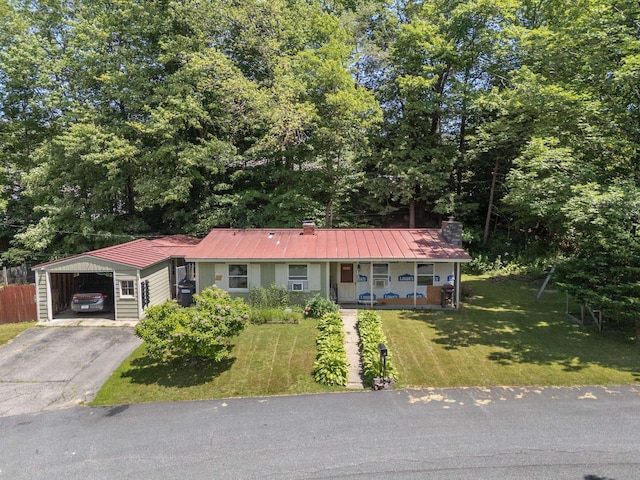 16 Brierbrook Ln, Springfield, VT 05156 - ranch-style home featuring a porch, a carport, a front lawn, driveway, and a metal roof