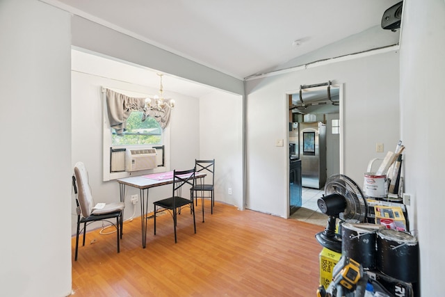16 Brierbrook Ln, Springfield, VT 05156 - dining space with a chandelier, vaulted ceiling, light wood-style floors, and cooling unit