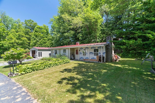 16 Brierbrook Ln, Springfield, VT 05156 - view of front of house with a chimney, a front yard, and covered porch