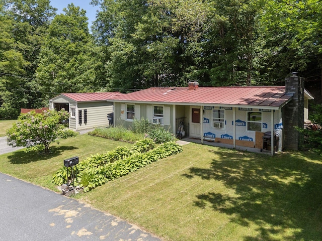16 Brierbrook Ln, Springfield, VT 05156 - view of front facade featuring a porch, a front yard, a chimney, and a metal roof