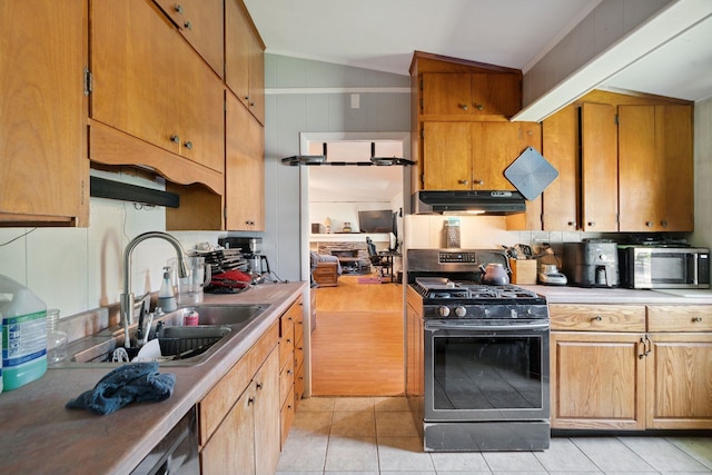 16 Brierbrook Ln, Springfield, VT 05156 - kitchen featuring gas stove, stainless steel microwave, under cabinet range hood, vaulted ceiling, and light tile patterned floors