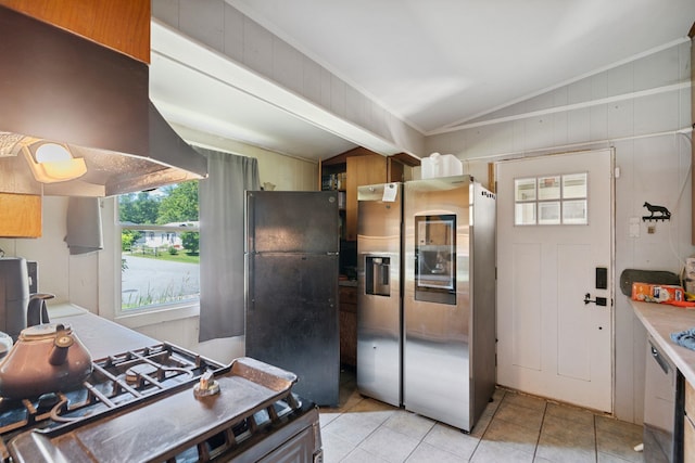 16 Brierbrook Ln, Springfield, VT 05156 - kitchen featuring freestanding refrigerator, stainless steel refrigerator with ice dispenser, range hood, vaulted ceiling, and light tile patterned floors