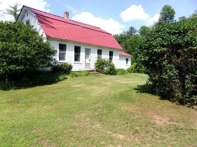 70 Wild Ammonoosuc Rd, Haverhill, NH 03785 - rear view of house featuring a gambrel roof, a yard, a metal roof, and a chimney