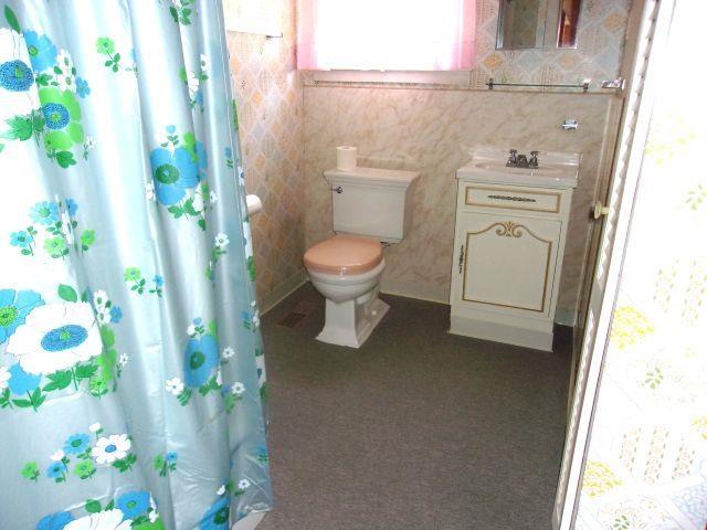 70 Wild Ammonoosuc Rd, Haverhill, NH 03785 - bathroom featuring vanity and curtained shower