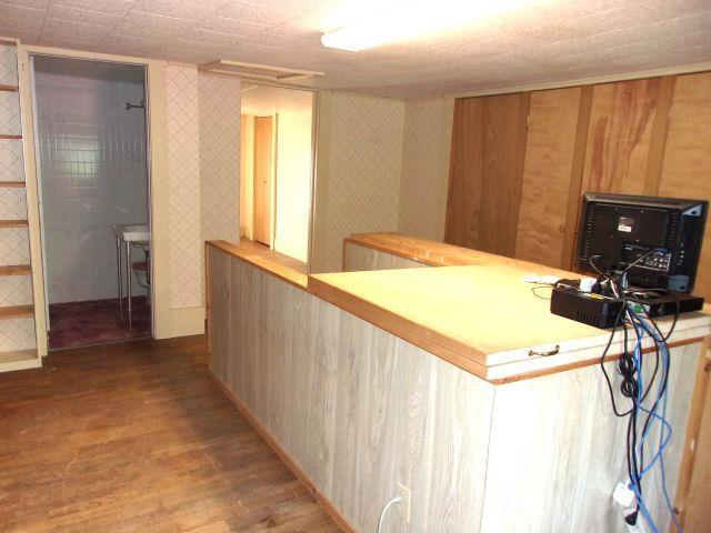 70 Wild Ammonoosuc Rd, Haverhill, NH 03785 - bar featuring wood finished floors and wallpapered walls