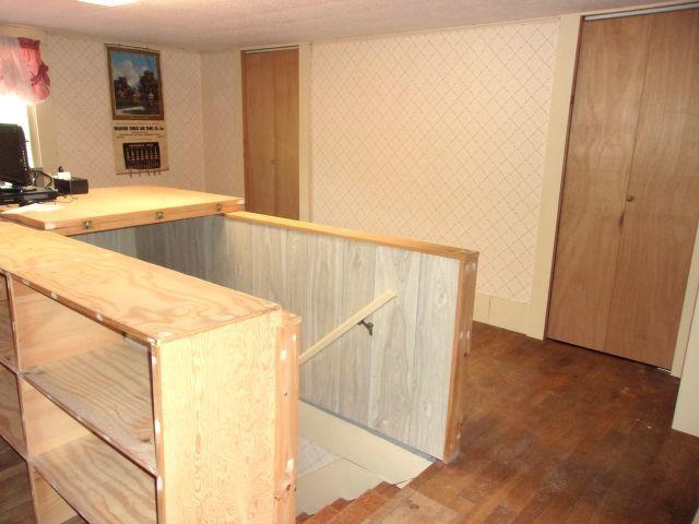 70 Wild Ammonoosuc Rd, Haverhill, NH 03785 - bar featuring wallpapered walls and dark wood-type flooring
