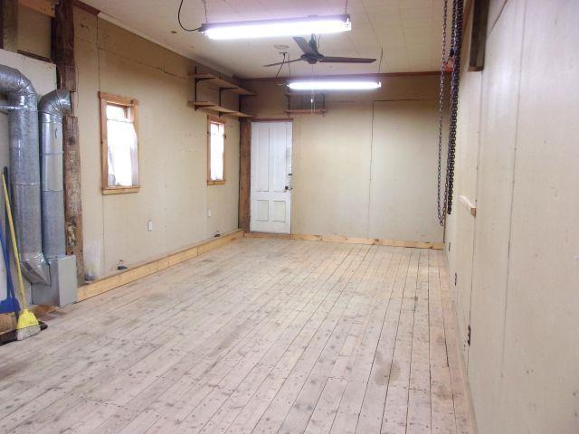 70 Wild Ammonoosuc Rd, Haverhill, NH 03785 - basement featuring hardwood / wood-style floors and a ceiling fan