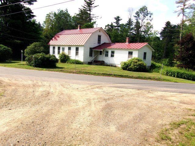 70 Wild Ammonoosuc Rd, Haverhill, NH 03785 - view of front of home featuring a gambrel roof, a chimney, a metal roof, and a front yard