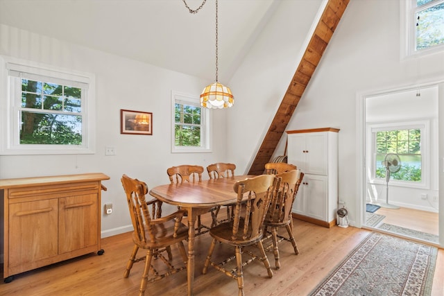 73 Lost Ln, Deering, NH 03244 - dining area with light wood-style floors, high vaulted ceiling, and beamed ceiling