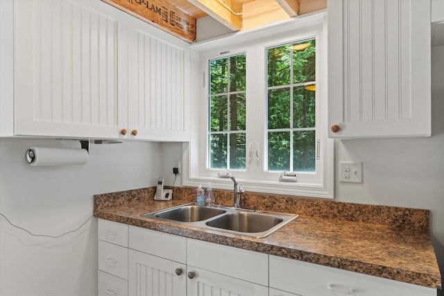 73 Lost Ln, Deering, NH 03244 - kitchen with healthy amount of natural light, dark countertops, and white cabinets