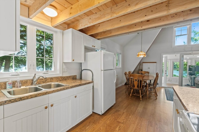73 Lost Ln, Deering, NH 03244 - kitchen featuring freestanding refrigerator, light wood-style floors, white cabinetry, decorative light fixtures, and wood ceiling