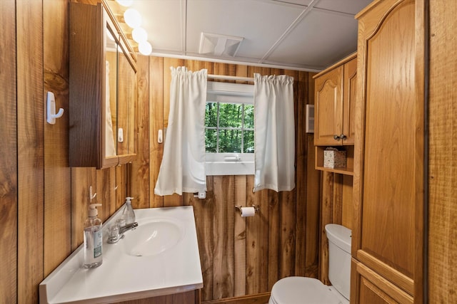 73 Lost Ln, Deering, NH 03244 - half bathroom with vanity and wood walls