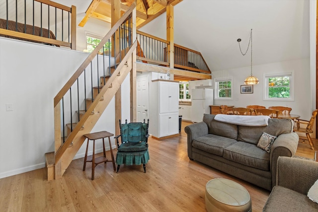 73 Lost Ln, Deering, NH 03244 - living room featuring stairs, light wood finished floors, and high vaulted ceiling