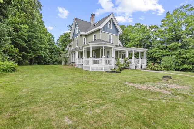 11 Palmer Ave, Plaistow, NH 03865 - back of property with a porch, a lawn, a chimney, ceiling fan, and roof with shingles