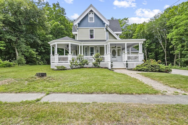 11 Palmer Ave, Plaistow, NH 03865 - view of front of home featuring a porch, a front yard, and board and batten siding