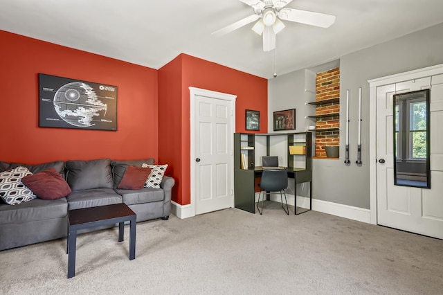11 Palmer Ave, Plaistow, NH 03865 - carpeted living area with ceiling fan and built in desk