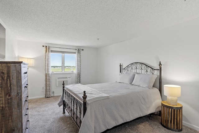 407 Ocean Blvd Unit A11, Hampton, NH 03842 - carpeted bedroom featuring a textured ceiling and an AC wall unit