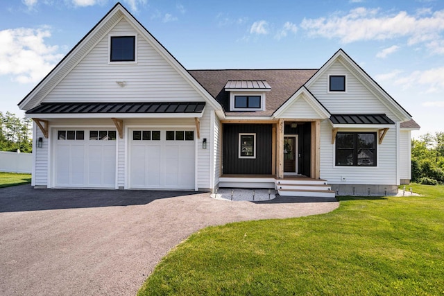422 Blane Cir Unit 50, Pembroke, NH 03275 - modern inspired farmhouse featuring a standing seam roof, a porch, a metal roof, asphalt driveway, and a front lawn