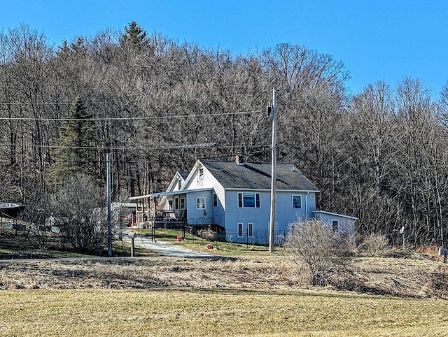 5559 W Creek Rd, Brandon, VT 05733 - view of home's exterior featuring a lawn and a wooded view