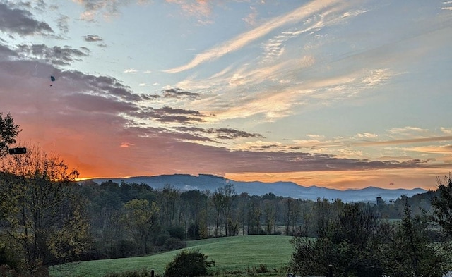 5559 W Creek Rd, Brandon, VT 05733 - view of mountain backdrop with a forest