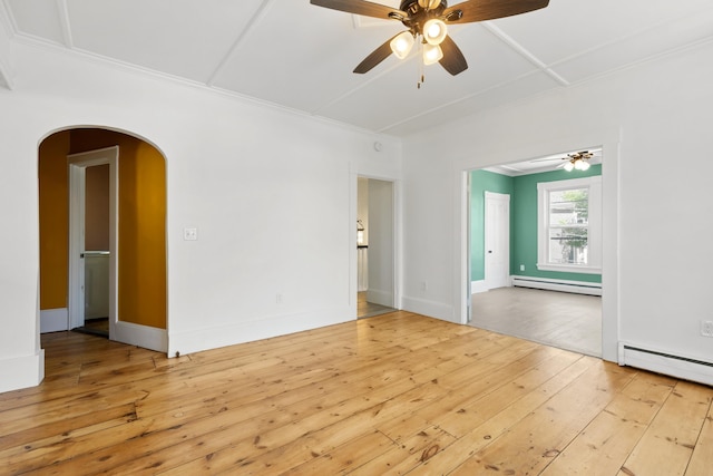 10 Prospect St, Somersworth, NH 03878 - spare room with baseboard heating, a ceiling fan, arched walkways, wood-type flooring, and ornamental molding