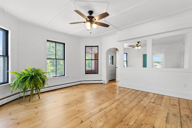 10 Prospect St, Somersworth, NH 03878 - empty room featuring ceiling fan, arched walkways, light wood finished floors, and crown molding