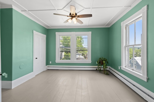 10 Prospect St, Somersworth, NH 03878 - empty room featuring plenty of natural light, baseboard heating, a ceiling fan, and ornamental molding