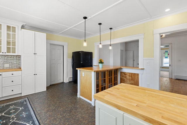 10 Prospect St, Somersworth, NH 03878 - kitchen featuring wood counters, glass insert cabinets, white cabinets, hanging light fixtures, and ornamental molding