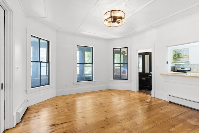 10 Prospect St, Somersworth, NH 03878 - entrance foyer featuring plenty of natural light, light wood-style flooring, a chandelier, and crown molding