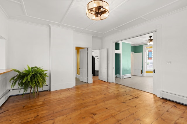 10 Prospect St, Somersworth, NH 03878 - spare room with a baseboard radiator, wood-type flooring, a chandelier, a ceiling fan, and ornamental molding
