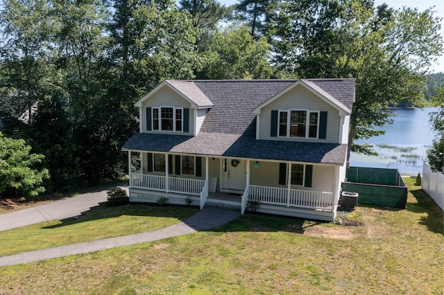 207 Long Pond Rd, Danville, NH 03819 - view of front of house with roof with shingles, a porch, and a front yard