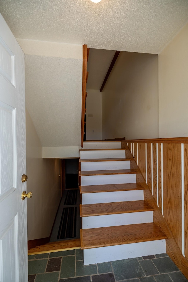 4B Pine Isle Dr Unit B, Derry, NH 03038 - stairway featuring stone finish floors and a textured ceiling