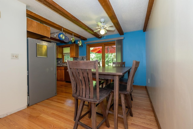 4B Pine Isle Dr Unit B, Derry, NH 03038 - dining room featuring ceiling fan, beam ceiling, and light wood finished floors