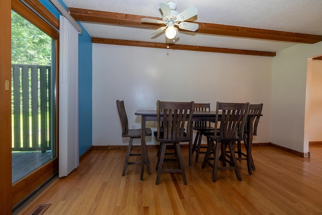 4B Pine Isle Dr Unit B, Derry, NH 03038 - dining area with beam ceiling, light wood finished floors, ceiling fan, and a textured ceiling