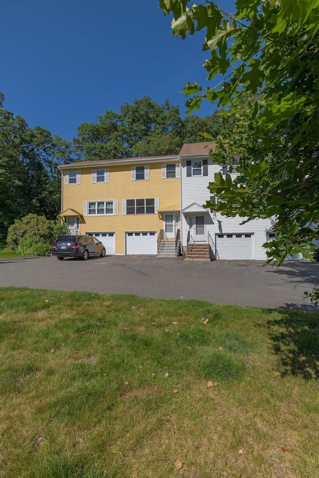 4B Pine Isle Dr Unit B, Derry, NH 03038 - townhome / multi-family property with entry steps, a front lawn, and driveway