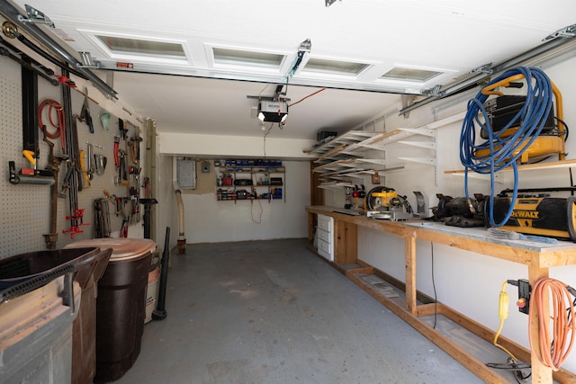 4B Pine Isle Dr Unit B, Derry, NH 03038 - garage featuring a workshop area and a garage door opener