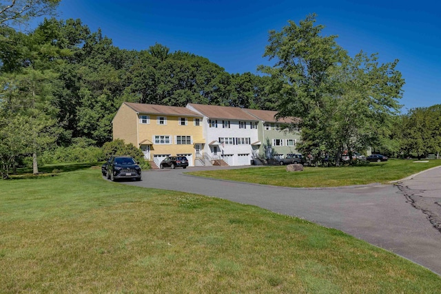 4B Pine Isle Dr Unit B, Derry, NH 03038 - view of front of house featuring driveway, a garage, and a front yard