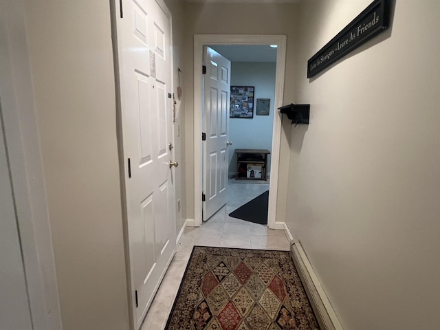 8B Deer Crk, Dover, VT 05356 - corridor with light tile patterned floors and a baseboard radiator