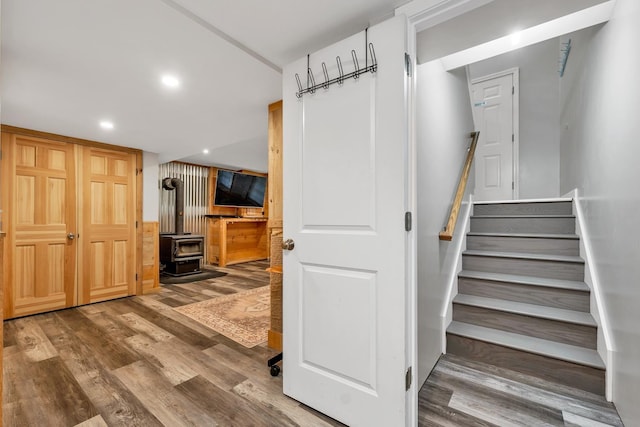 16 Damsite Rd, Barnstead, NH 03225 - stairway with a wood stove, wood finished floors, and recessed lighting