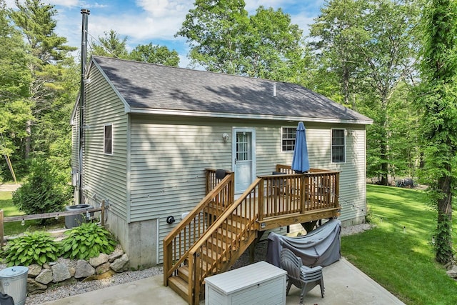 16 Damsite Rd, Barnstead, NH 03225 - back of house with a patio area, a lawn, roof with shingles, and a deck