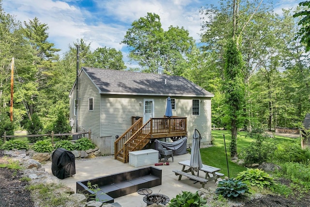 16 Damsite Rd, Barnstead, NH 03225 - rear view of property featuring a patio area, an outdoor fire pit, a wooden deck, stairs, and a shingled roof