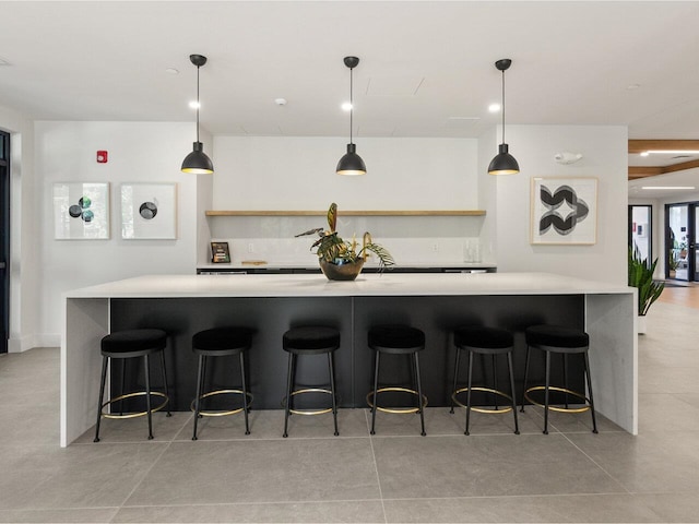 125 Cambrian Way Unit 610, Burlington, VT 05401 - kitchen with light countertops, pendant lighting, a kitchen breakfast bar, and open shelves